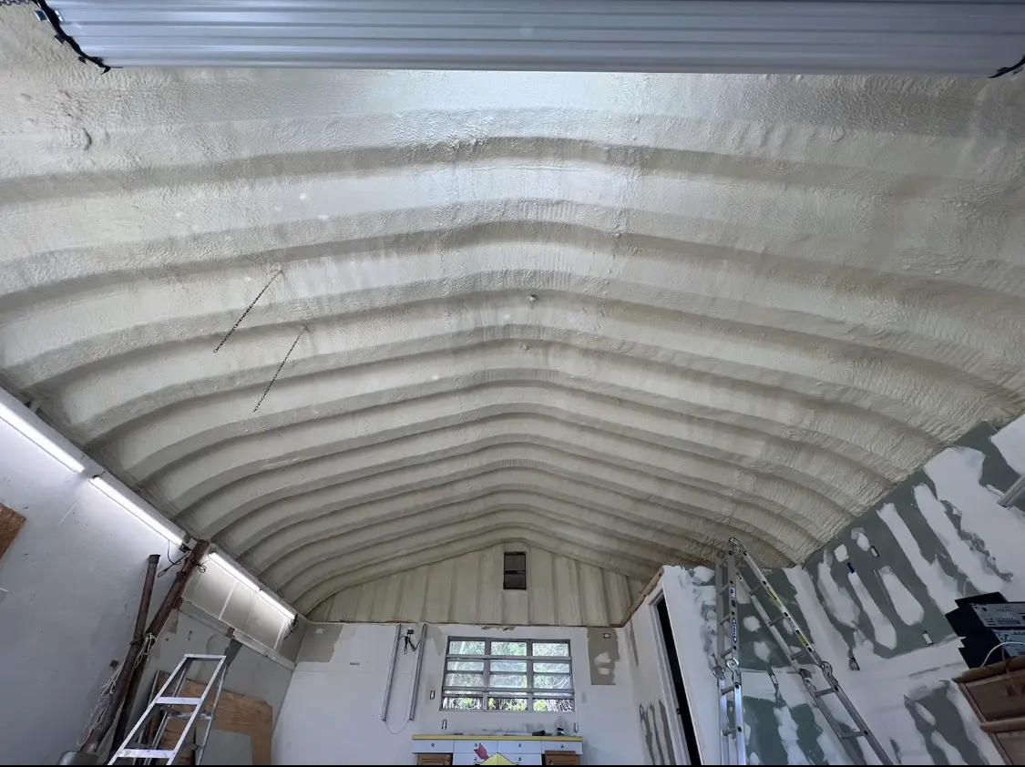 Spray polyurethane foam applied to the underside of a metal roof deck in North Hempstead